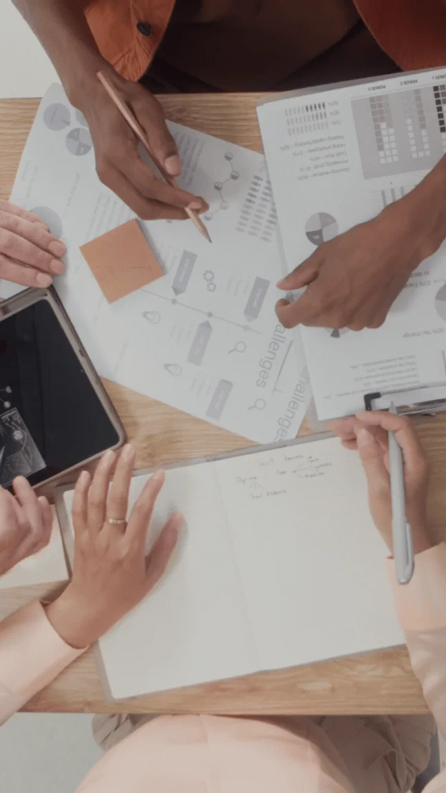 Team brainstorming software strategy documents with Suave Creators