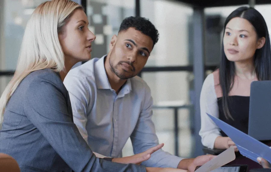 Business team collaborating on a custom software project with Suave Creators